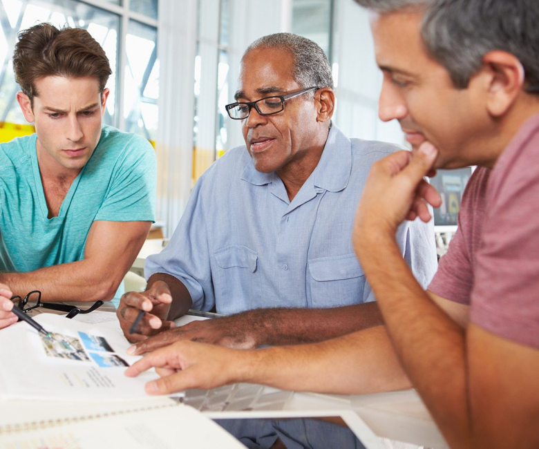 demo-attachment-121-group-of-men-meeting-in-creative-office-PXEKFW4